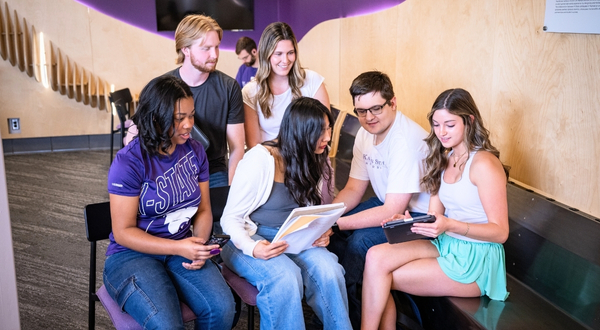 A group of K-State Salina students congregate and enjoy each other's presence at an on-campus event. 