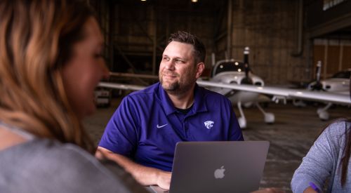 Graduate student studying in a hangar on the K-State Salina campus