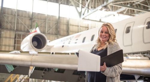 Graduate student working in a hangar at the K-State Salina campus