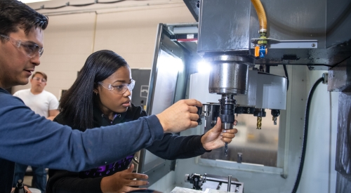 A K-State Salina student works on composites in on campus lab. 