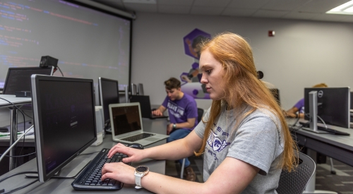 A K-State Salina student works on building a website during class.