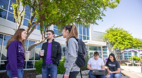 Students conversing on the K-State Salina campus.