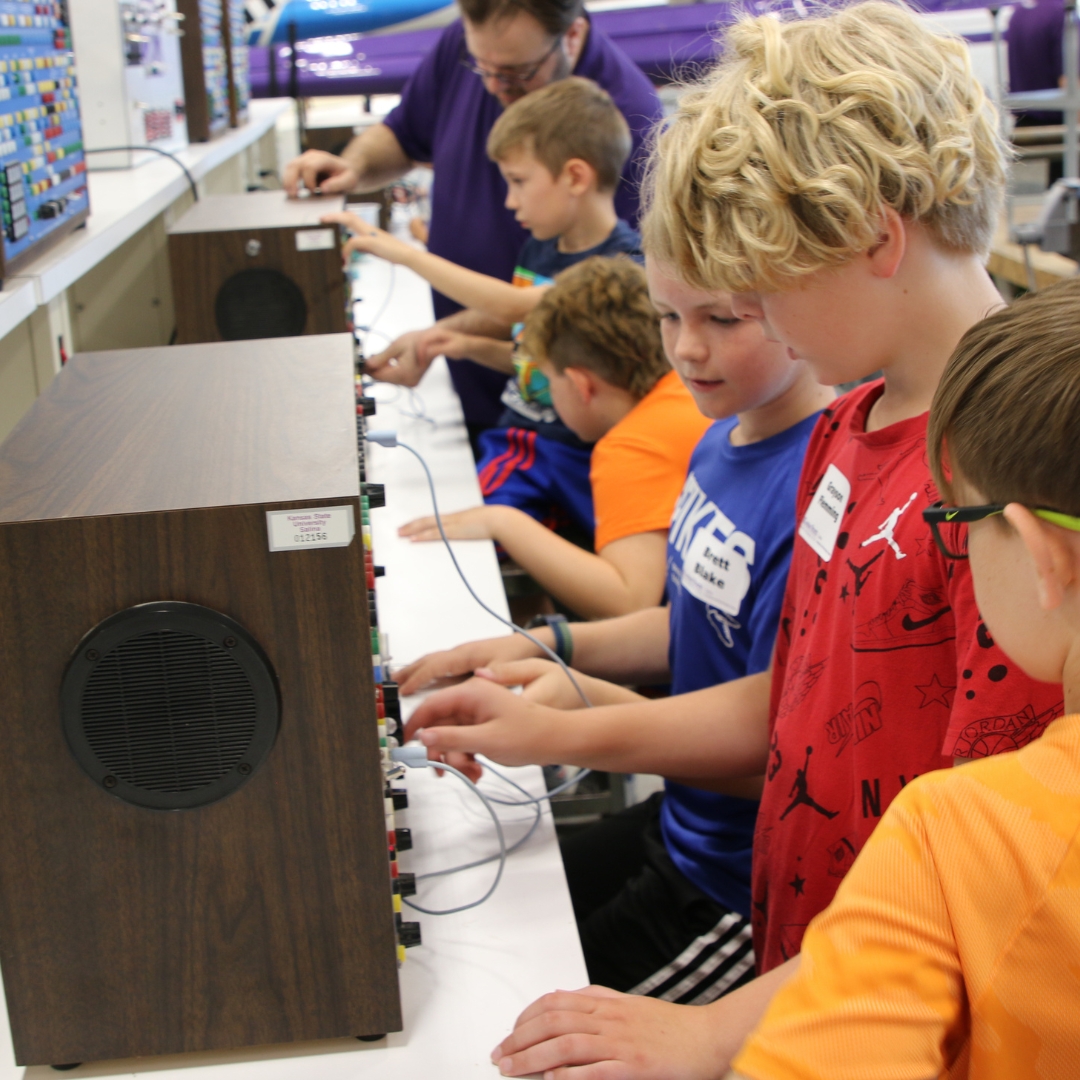 Elementary aged students learn about electricity in aviation through K-State Salina aviation maintenance courses at summer camp.