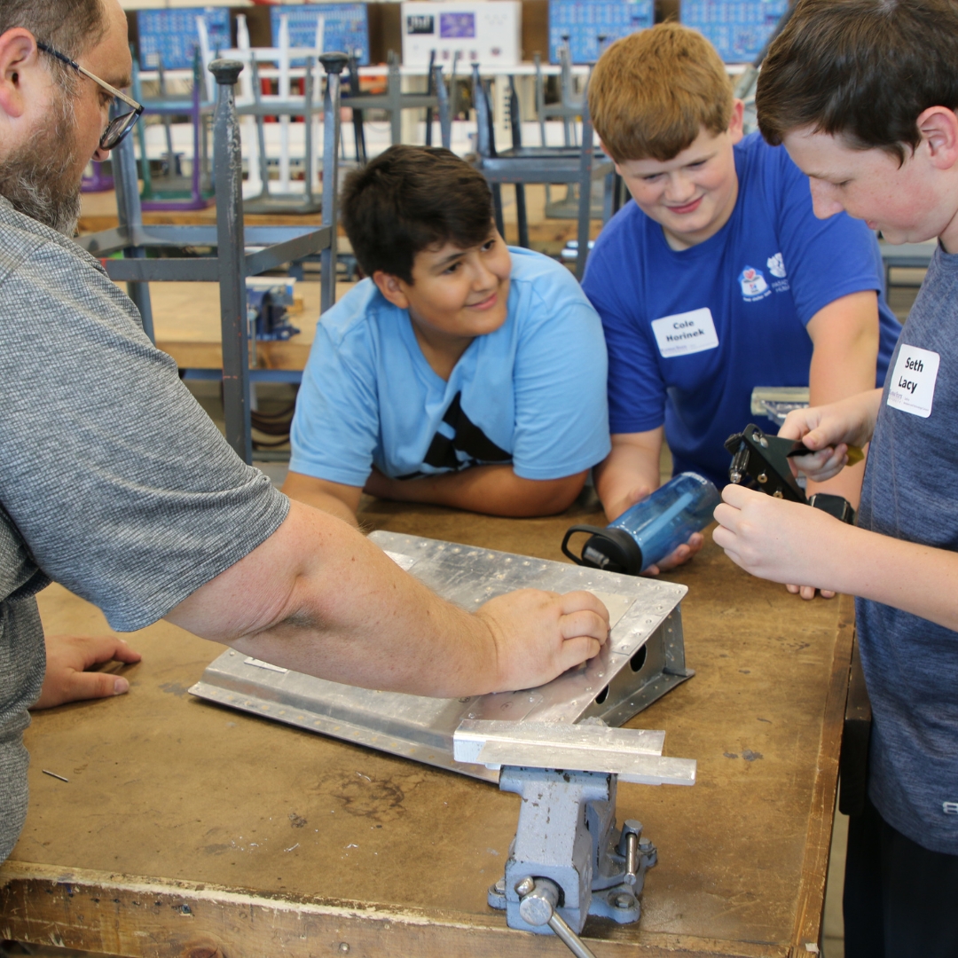 Middle school aged students at K-State Salina's summer camps learn about riveting for aviation maintenance