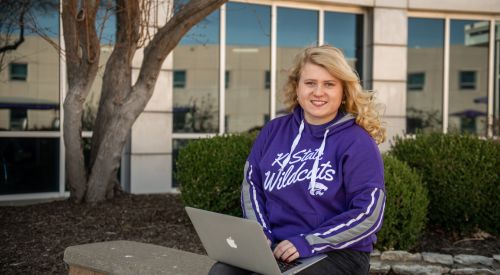 Students can transfer from another school to K-State Salina as student studies on her computer. 