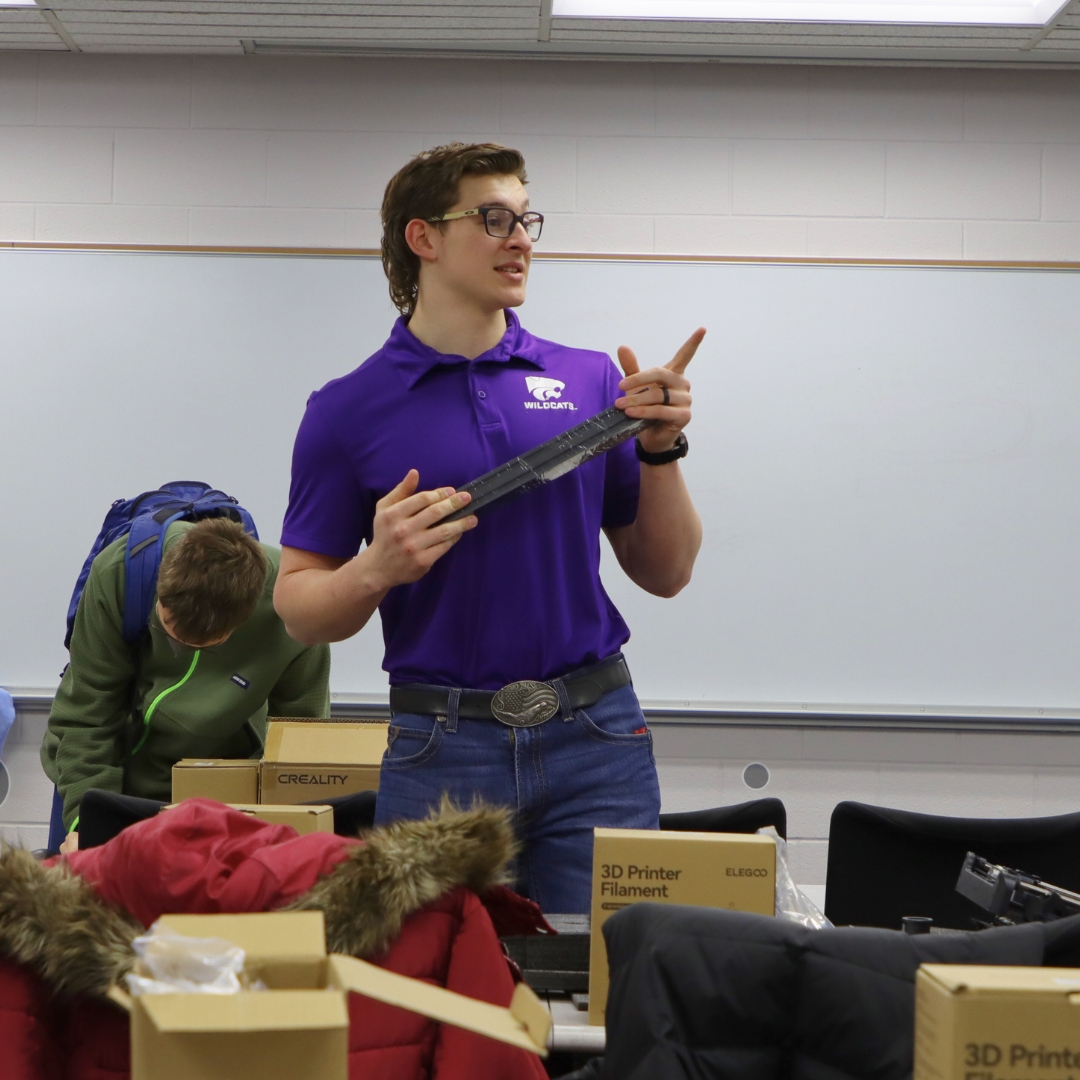 A K-State Salina student instructs 3D printing, a professional education course.