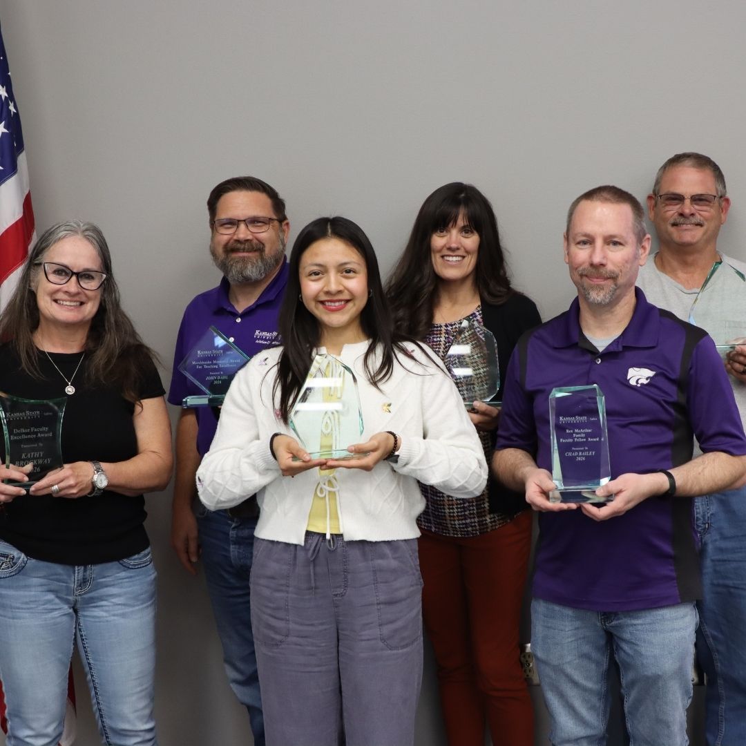 K-State Salina award winners holding their plaques. 