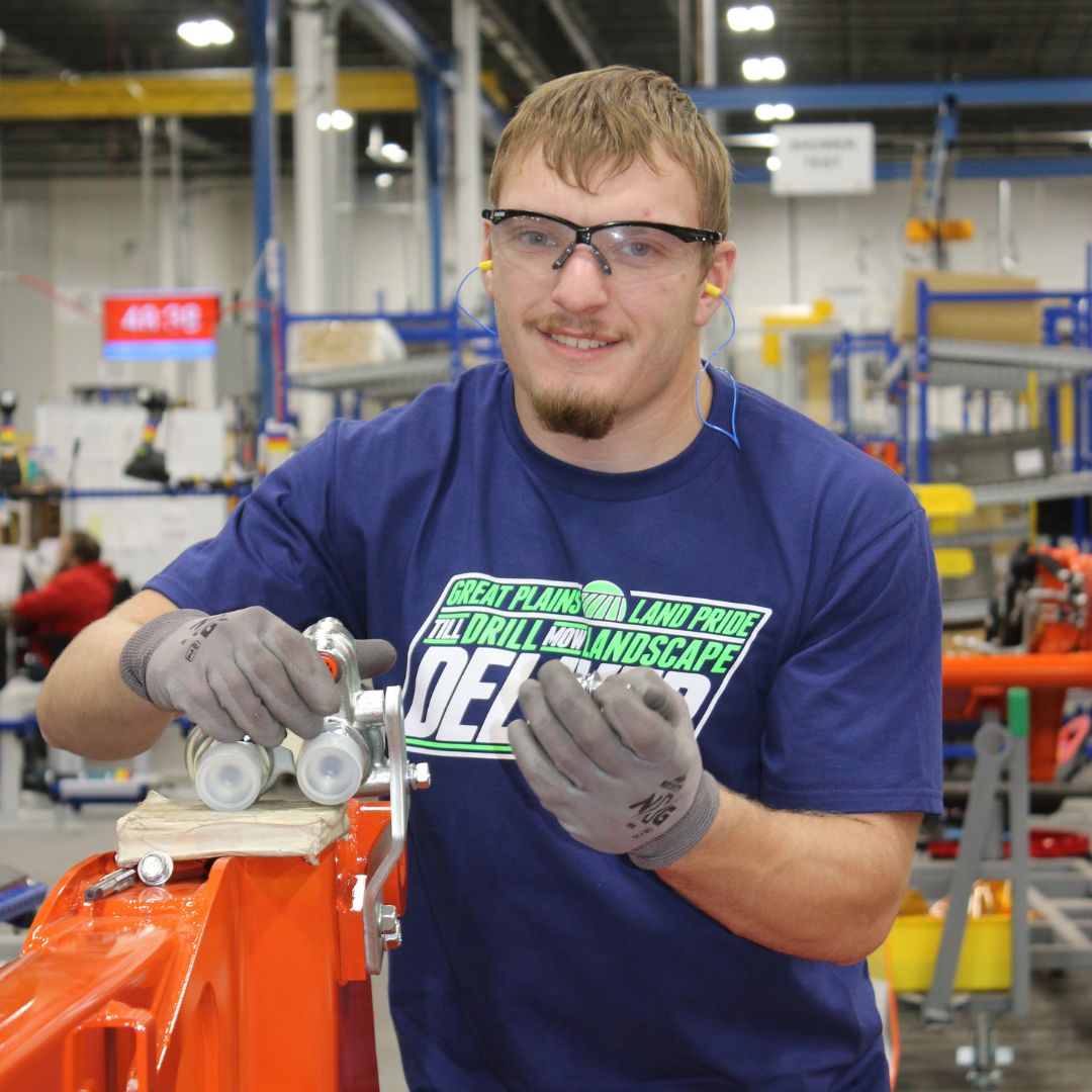 A student in the GPM Scholars Program works at Great Plains Manufacturing while she is enrolled at K-State Salina.