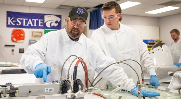 Two people working on a composites project at K-State Salina.