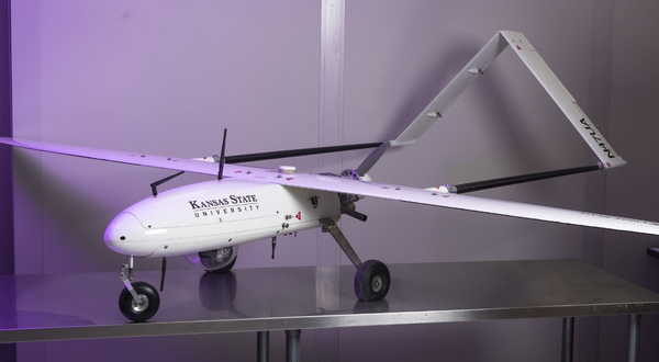 UAV Factory Penguin-B drone with purple light backdrop at the K-State Salina campus