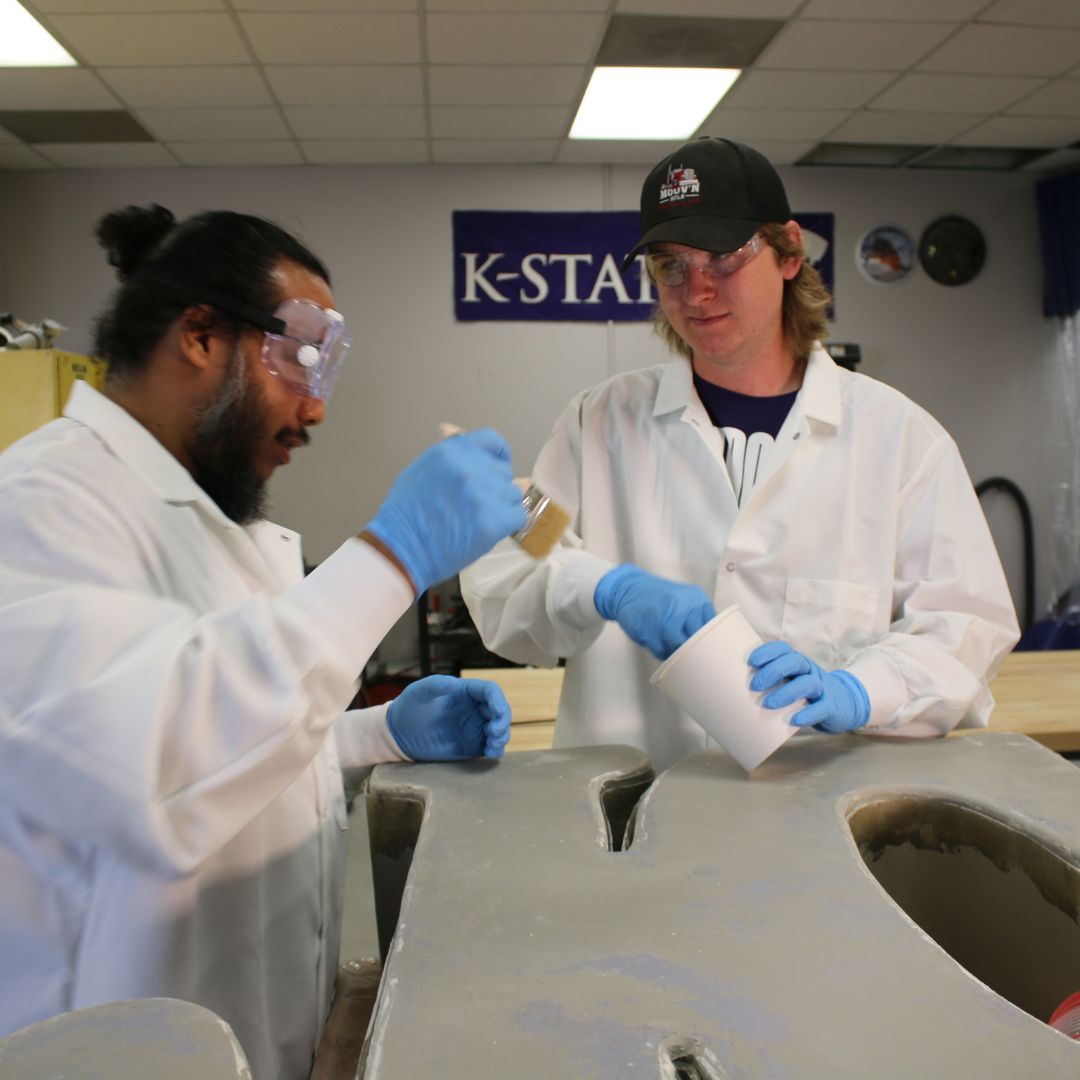 Composites students work on constructing a JC statue for a client